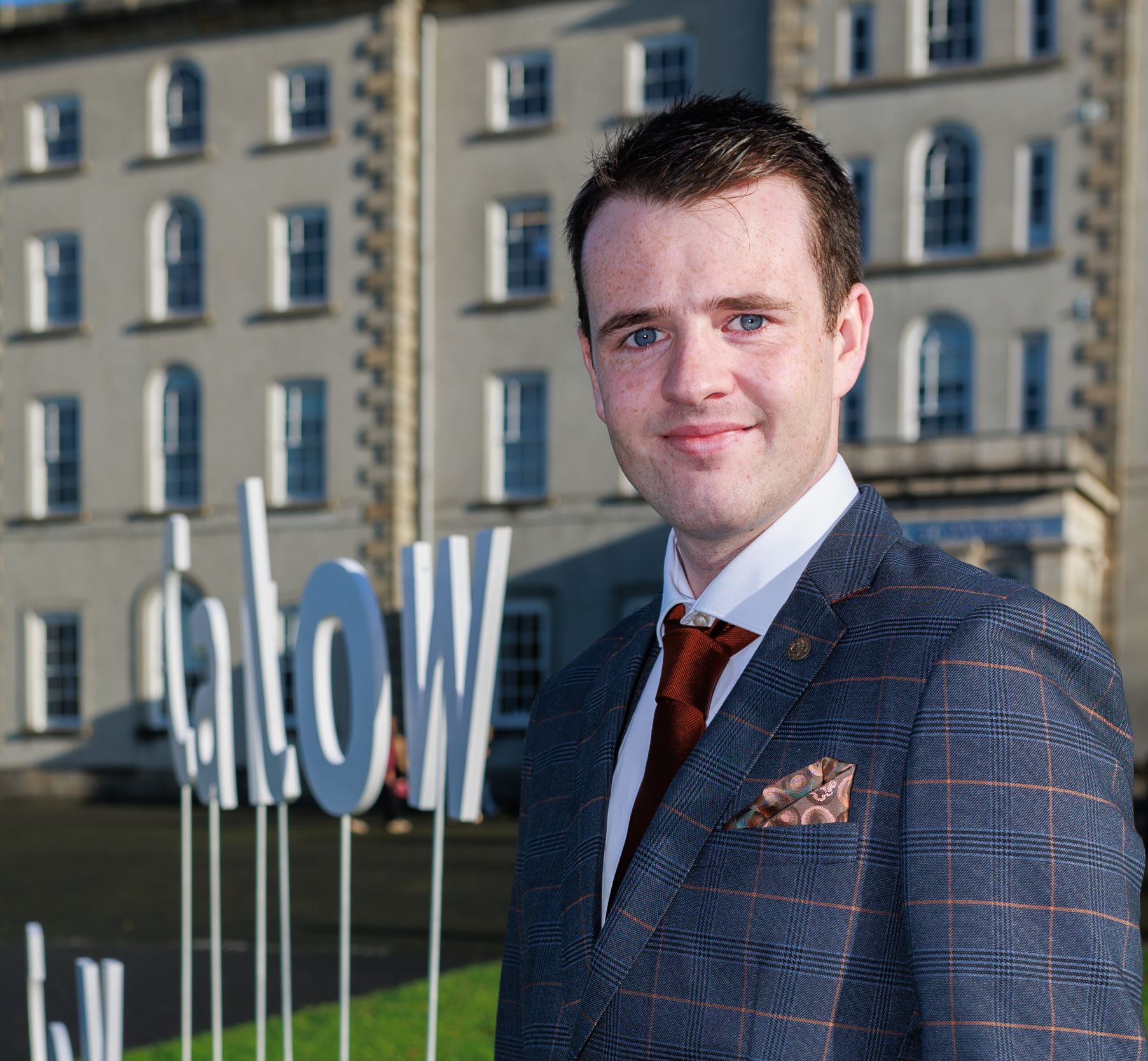 Cian Loakman pictured outside the College on his graduation day