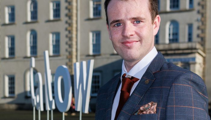 Cian Loakman pictured outside the College on his graduation day